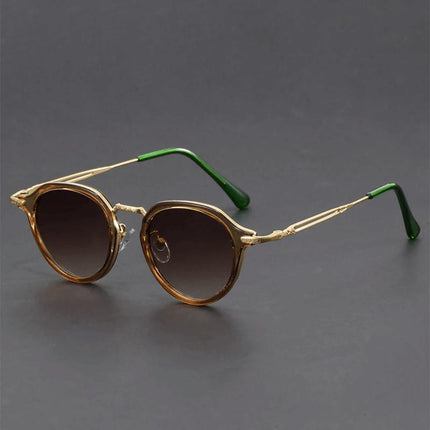 Anteojos de sol retro Helios con lentes redondos marrones y patillas metálicas verdes para adultos, estilo vintage moderno.