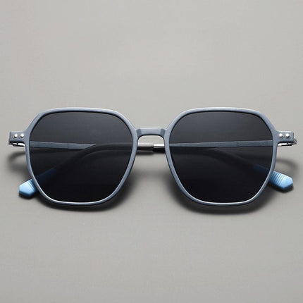 Anteojos de sol Tom Anderson de acetato mate azul para adultos con protección UV400 y patillas metálicas estilizadas.