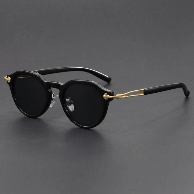 Anteojos de sol vintage Dylan, negros con detalles metálicos dorados, estilo retro moderno, lentes degradé, unisex.