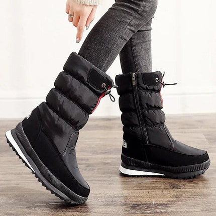 Bota impermeable de nieve para mujer, color negro, hecha de piel sintética, ideal para invierno, estilo moderno.