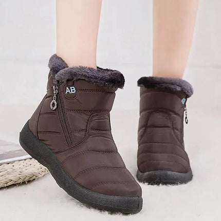 Bota impermeable chic marrón para mujeres, con forro de felpa y cierre lateral, ideal para invierno.