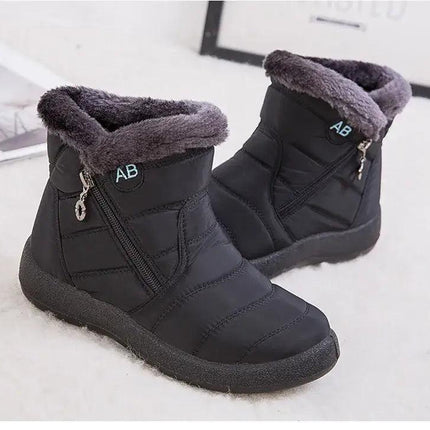 Botas impermeables negras con forro de felpa para mujer, diseño moderno y tacón bajo, protección invernal elegante.