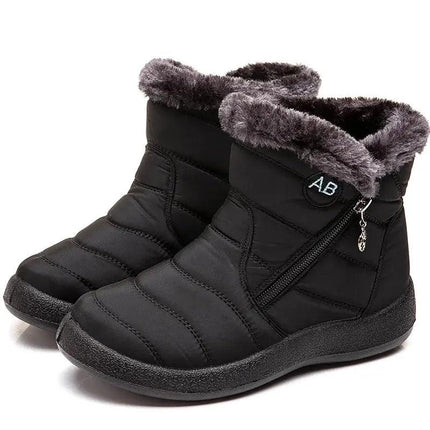 Bota impermeable negra para mujer, diseño elegante con felpa, ideal para invierno y climas fríos.