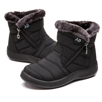 Bota impermeable negra con abrigo de felpa para mujeres, ideal para invierno y clima frío, diseño moderno y elegante.
