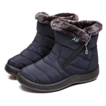 Bota impermeable negra de mujer con forro felpa gris, diseño moderno, ideal para invierno y climas fríos.