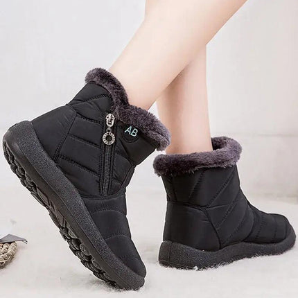 Bota impermeable negra para mujer, con forro de felpa y cierre, ideal para invierno, cómoda y moderna.
