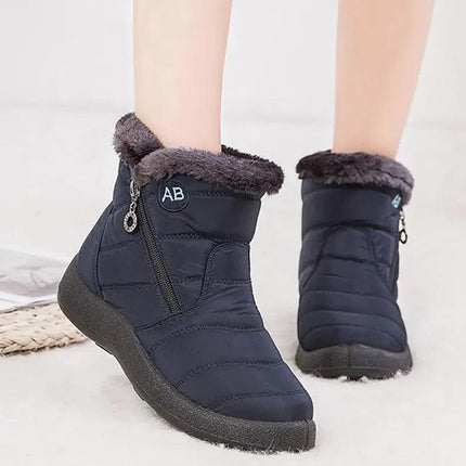 Bota impermeable azul marino con abrigo de felpa, diseño elegante para mujeres en invierno, comodidad y protección.