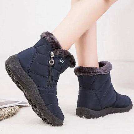 Bota impermeable azul con abrigo interior de felpa, diseño moderno, para mujeres, ideal para invierno.