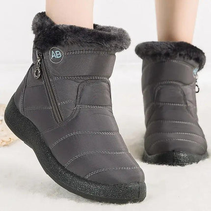 Bota impermeable chic para mujer, color gris oscuro, con abrigo interno de felpa y diseño moderno para invierno. Ideal para nieve.