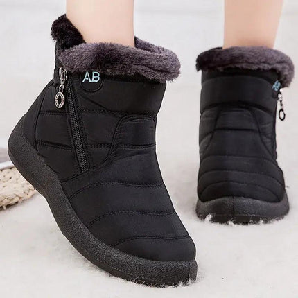Bota impermeable negra para mujer, forro interior de felpa, diseño moderno, ideal para invierno y climas fríos.