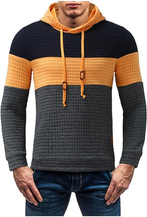 Buzo Melbourne con capucha ajustable para hombre, diseño en bloques negro, amarillo y gris, estilo casual moderno.