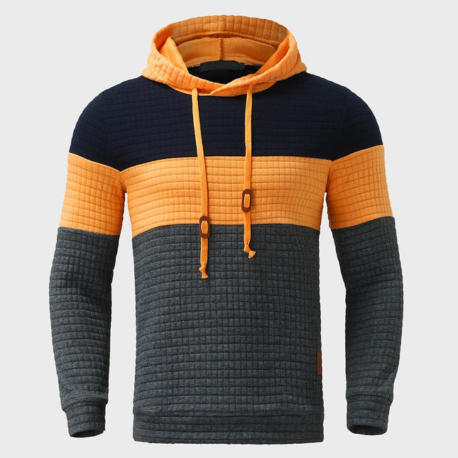 Buzo Melbourne para hombre en bloques de color azul, naranja y gris, con capucha y tejido suave, estilo casual.