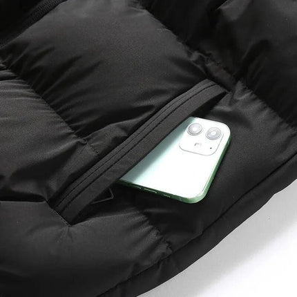 Chaleco ThermoShield negro para hombre, sin mangas, capucha desmontable, bolsillos con cierre, térmico, estilo moderno.