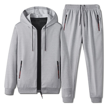 Conjunto Vland gris para hombre, buzo con capucha y jogger casual, cierre frontal, bolsillos laterales, estilo moderno.