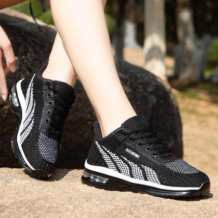 Zapatillas deportivas transpirables negras para adultos con diseño ergonómico y piso anti-impacto en oferta.