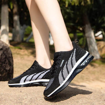 Zapatillas deportivas transpirables negras y blancas, diseño ergonómico, suela anti-impacto ideal para actividades, unisex.