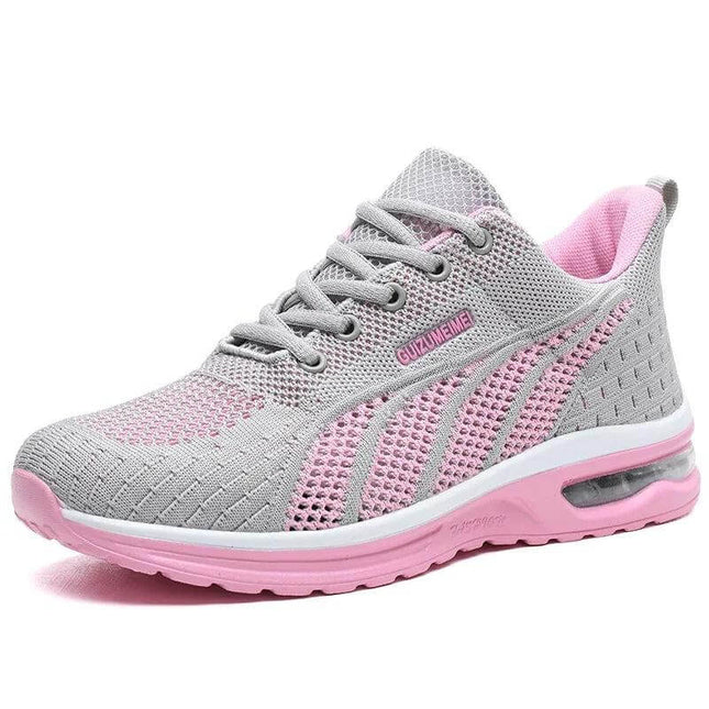 Zapatilla deportiva transpirable gris y rosa para mujer, diseño ergonómico, suela anti-impacto, ideal para uso diario.