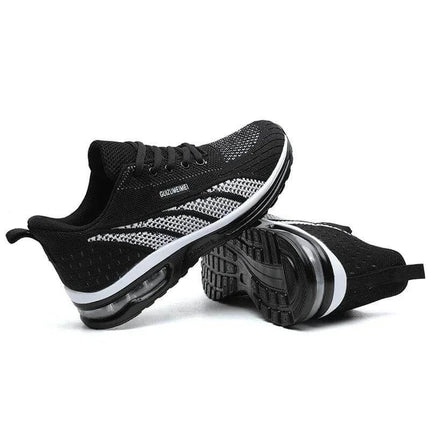 Zapatillas deportivas transpirables negras con blanco para adultos, diseño ergonómico y suela anti-impacto.