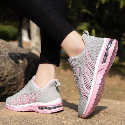 Zapatillas deportivas transpirables gris con rosa para mujer, diseño ergonómico y suela anti-impacto de podología.