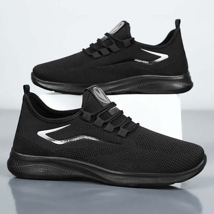 Zapatillas urbanas de malla negra para uso diario, ligeras y cómodas, ideal para paseos en la ciudad.