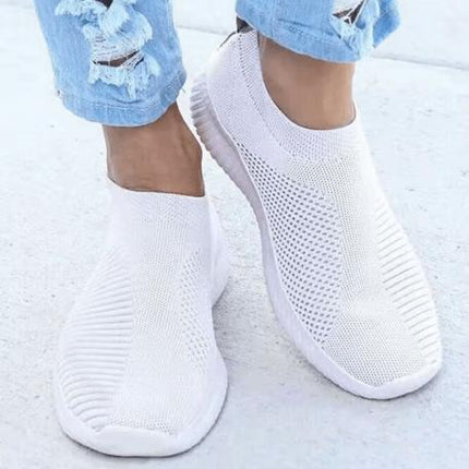 Zapatillas Jade blancas de tejido transpirable para mujer, ideales para mejorar postura y absorción de impactos.