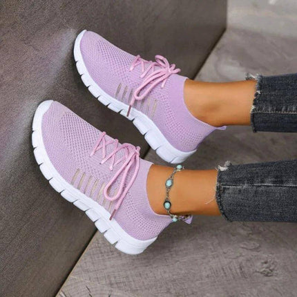 Zapatillas mujer transpirables Zenithi en malla rosa, diseño ergonómico y suela flexible, para comodidad diaria.