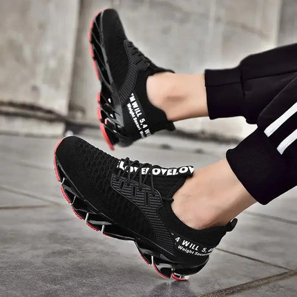 Zapatillas ShockAir Hombre en negro, con suela amortiguadora roja y diseño moderno, ideales para uso diario y confort.