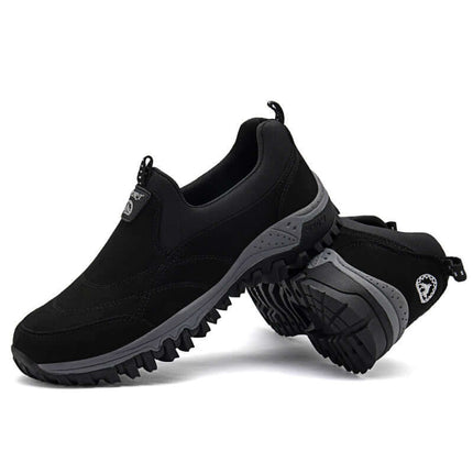 Zapato Trail Grip para adultos, color negro, suela flexible, material transpirable, diseño protector, ideal trekking y senderismo.