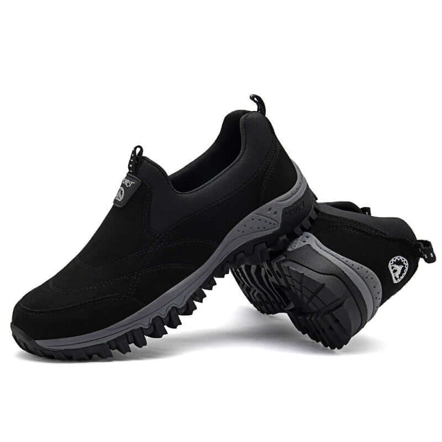 Zapato Trail Grip para adultos, color negro, suela flexible, material transpirable, diseño protector, ideal trekking y senderismo.