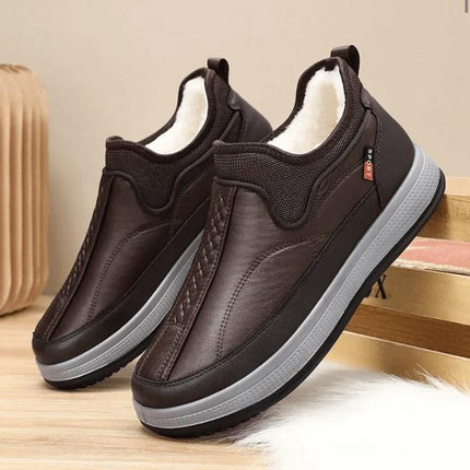 Zapato de invierno marrón oscuro para adultos, hecho de material transpirable y elástico, ideal para calidez y conforto.