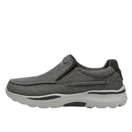 Zapatos de lona sin cordones grises para hombres, con suela antideslizante y diseño moderno, ideales para confort y estilo diario.