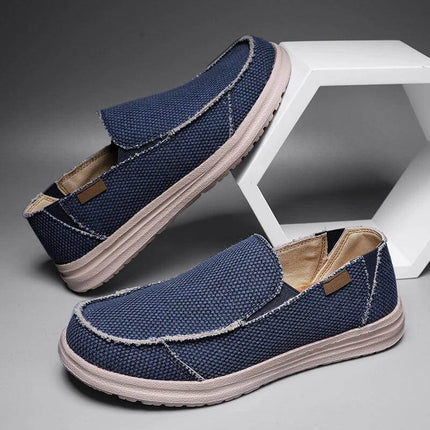 Zapatos informales transpirables de lona azul para hombre, suela blanca resistente, diseño moderno y cómodo.