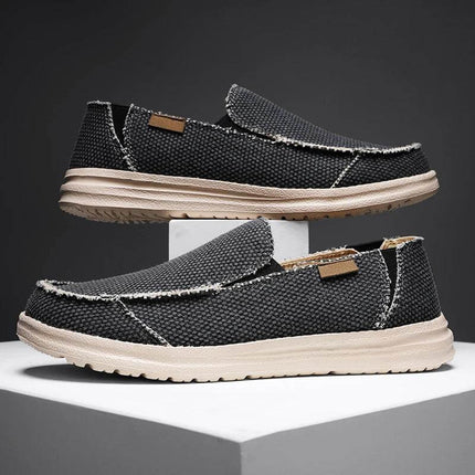 Zapatos informales de lona negra para hombre, transpirables y cómodos, ideales para un estilo casual. Calzado versátil y ligero.
