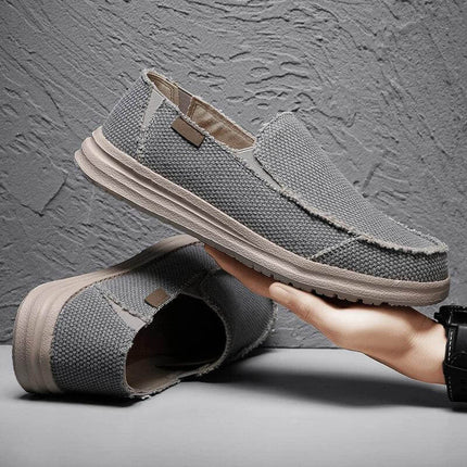 Zapatos informales grises de lona para hombre, transpirables con diseño moderno y resistente.
