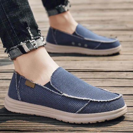 Zapatos informales de lona azul para hombres, transpirables y cómodos, ideales para un estilo casual relajado.