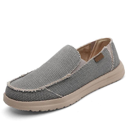 Zapato informal transpirable de lona gris para hombre, cómodo y moderno, ideal para el uso diario.