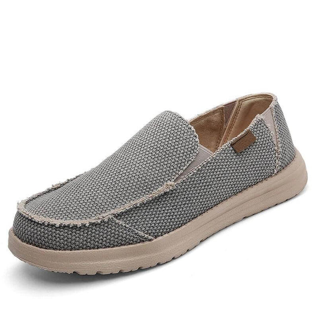 Zapato informal transpirable de lona gris para hombre, cómodo y moderno, ideal para el uso diario.